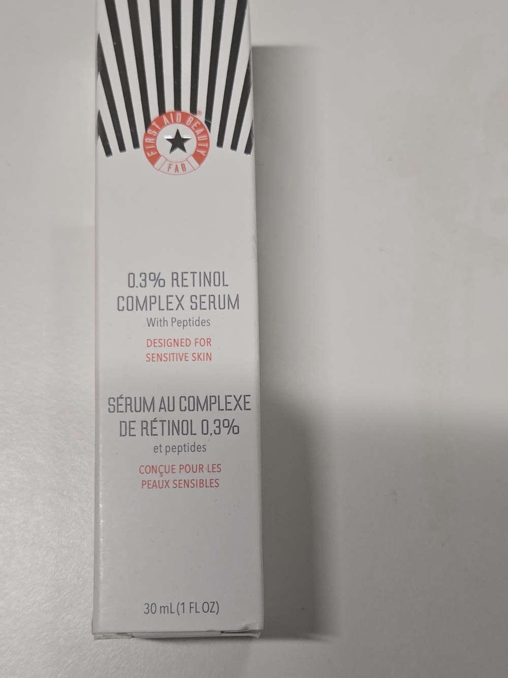 First Aid Beauty 0.3% Retinol Complex Serum - White with Coral Accents